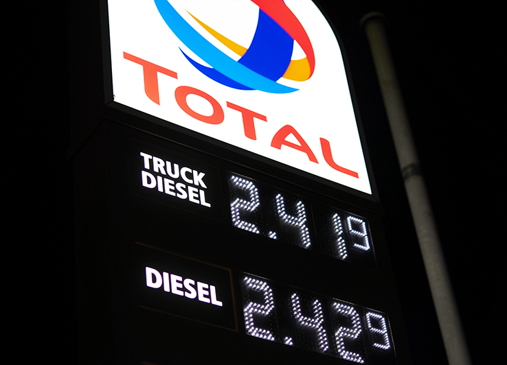 Denkendorf, Germany - March 09, 2022: Close up of Price board with high gasoline, diesel and fuel prices. Most expensive gas and oil prices at German Total filling station in Europe.